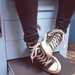 black converse waiting in a waiting room